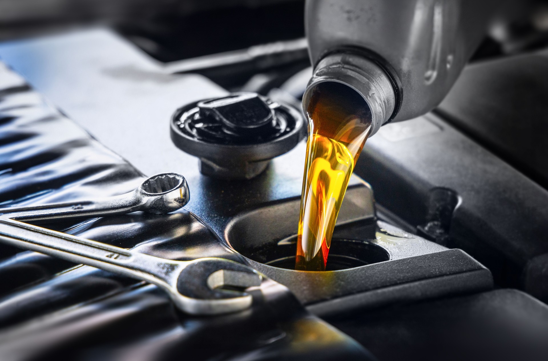 Pour new automotive engine oil into the engine